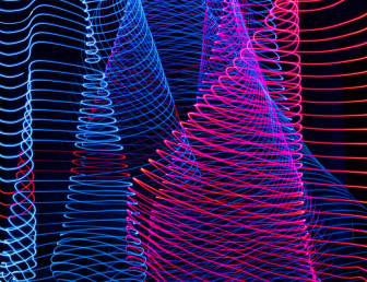 A striking light painting showcasing a blend of blue and red colors on a contrasting black background.