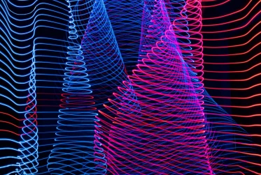 A striking light painting showcasing a blend of blue and red colors on a contrasting black background.