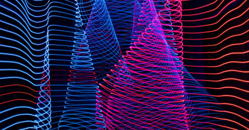A striking light painting showcasing a blend of blue and red colors on a contrasting black background.