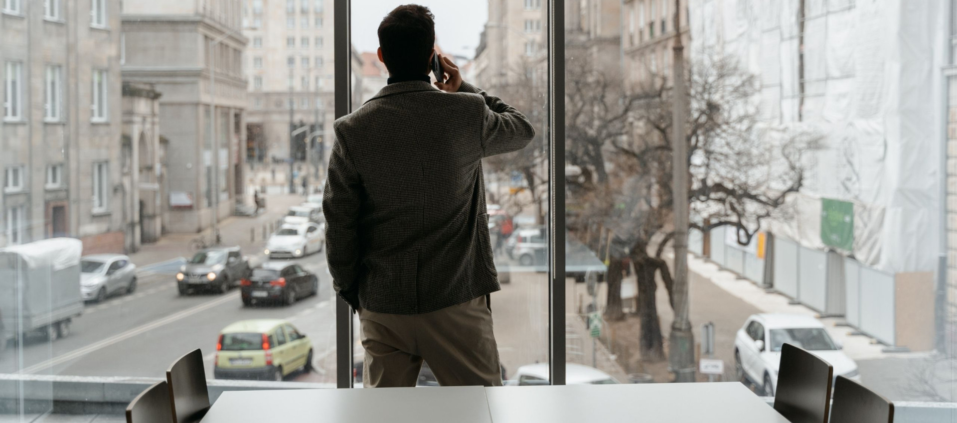 man in an office speaking on the phone