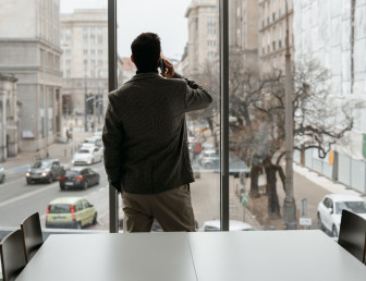 man in an office speaking on the phone