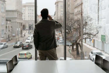 man in an office speaking on the phone