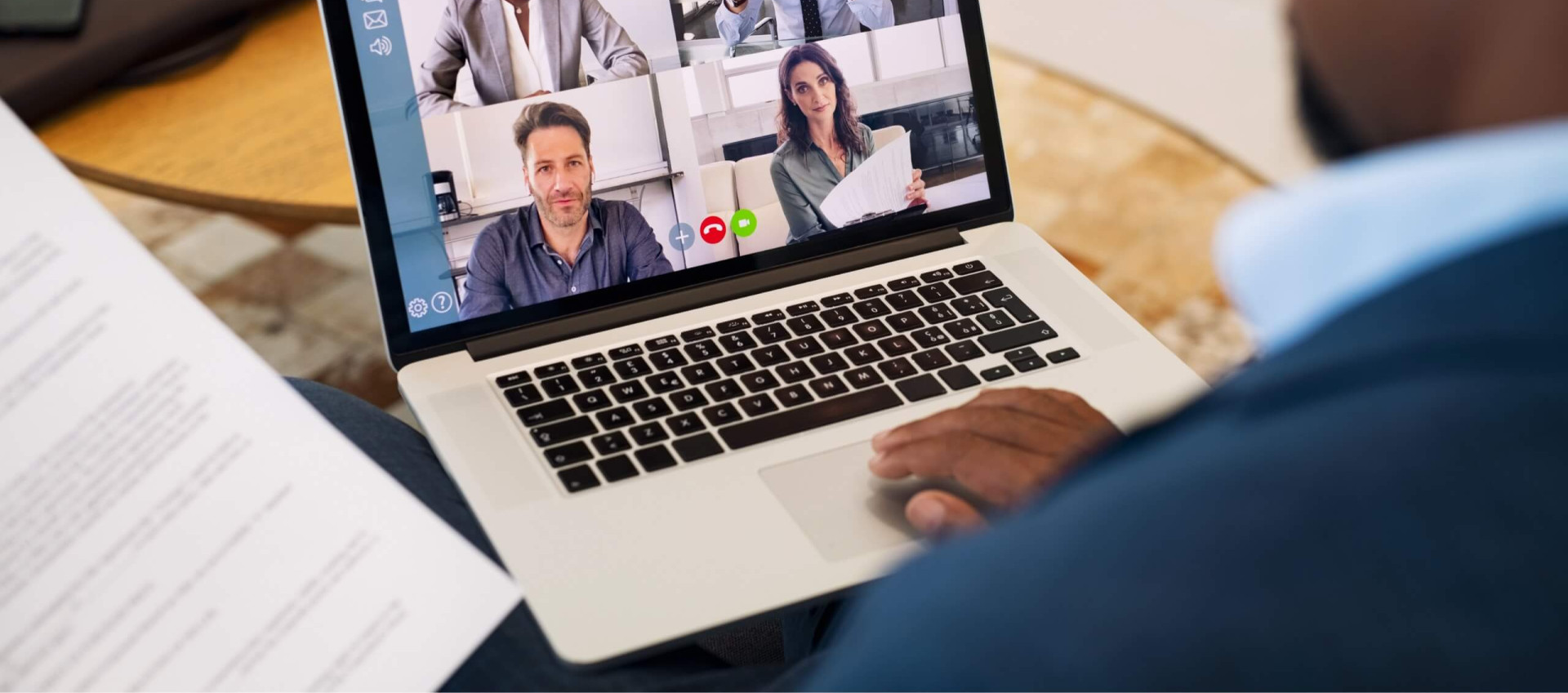 split screen of four people on video call on laptop