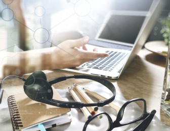 person at computer with dots overlay SH001