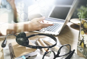 person at computer with dots overlay SH001