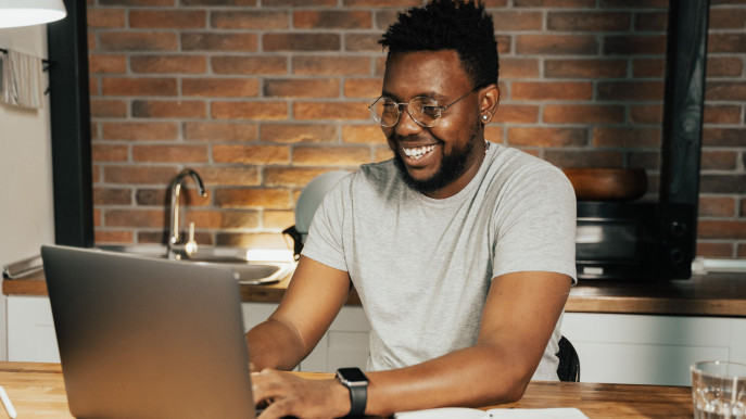smiling man laptop
