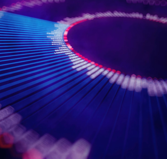 woman in smart clothing addressing a group of people in an office