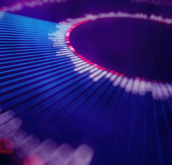 woman in smart clothing addressing a group of people in an office