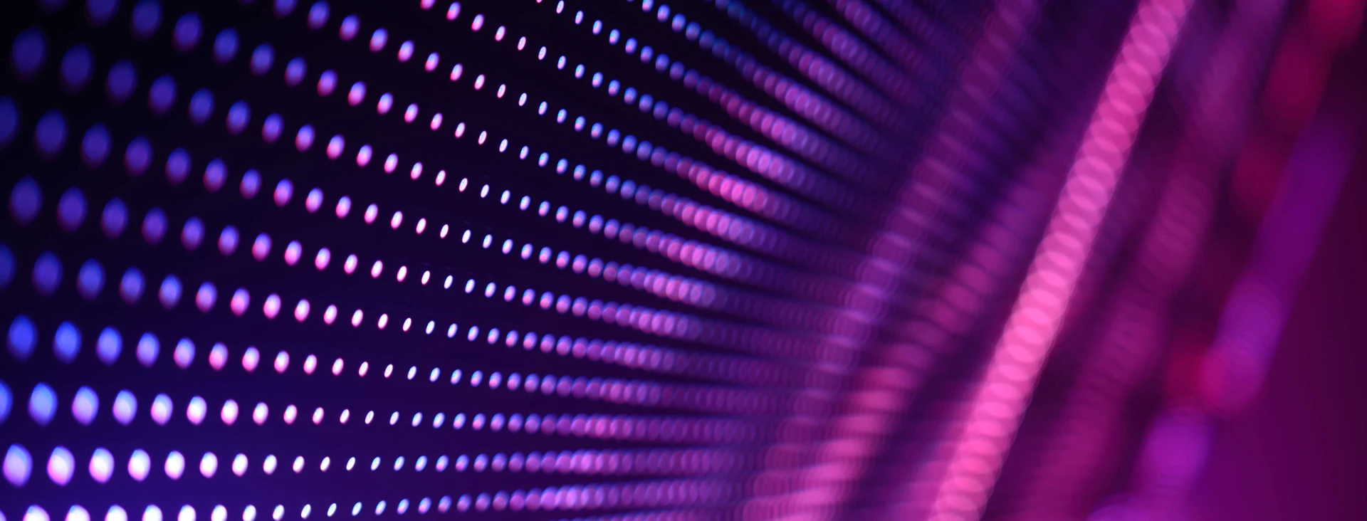 digital pattern of a wall of dots in purple and pink colours