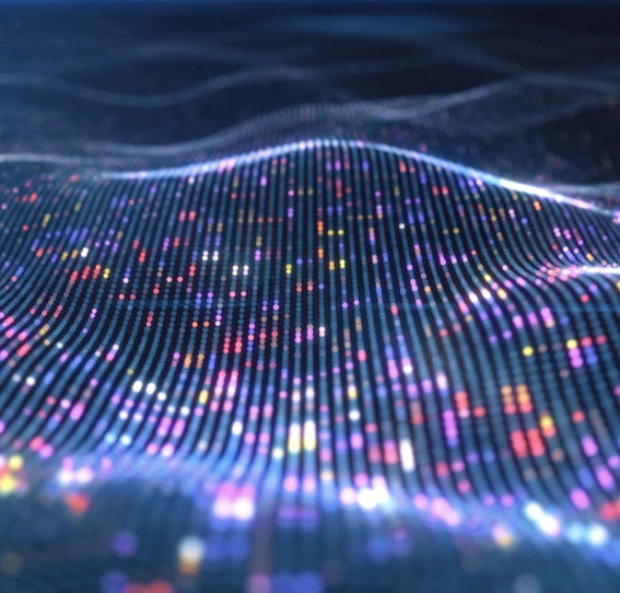 digital pattern of dots in a wave shape in various colours with a navy blue background