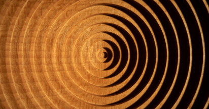 orange and black geometric pattern in a circular shape