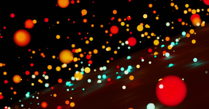several circle shaped objects in multiple colours on a dark background