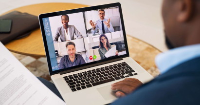 split screen of four people on video call on laptop