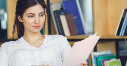 woman sitting reading documents