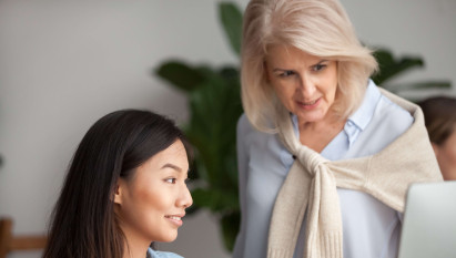 two women looking at laptop