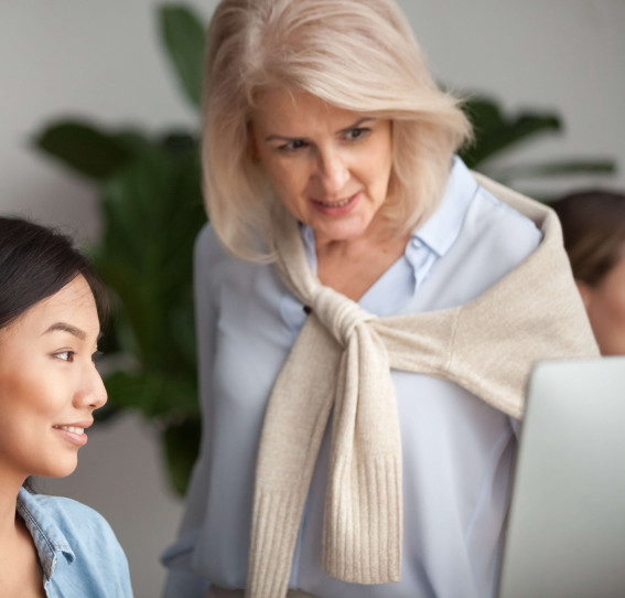 two women looking at laptop