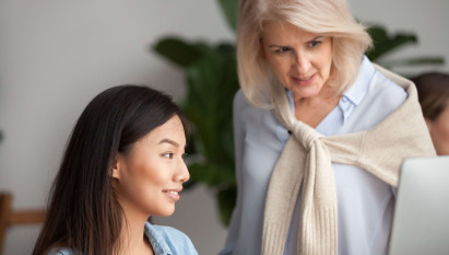 two women looking at laptop