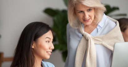two women looking at laptop