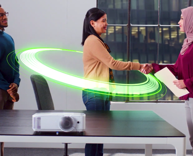 graphic green ring surrounds woman while shaking another woman's hand with a man onlooking